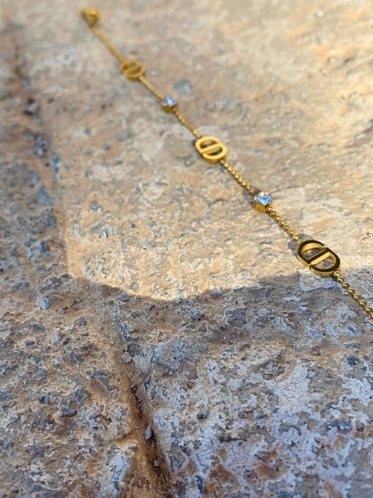 Βραχιόλι αλυσίδα από ατσάλι με στρας και λογότυπο