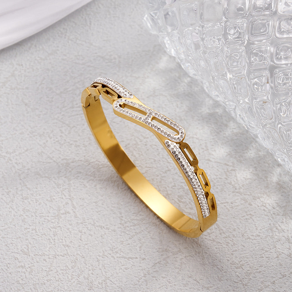 Βραχιόλι χειροπέδα με κεντρική μπάρα από στρας χρυσό