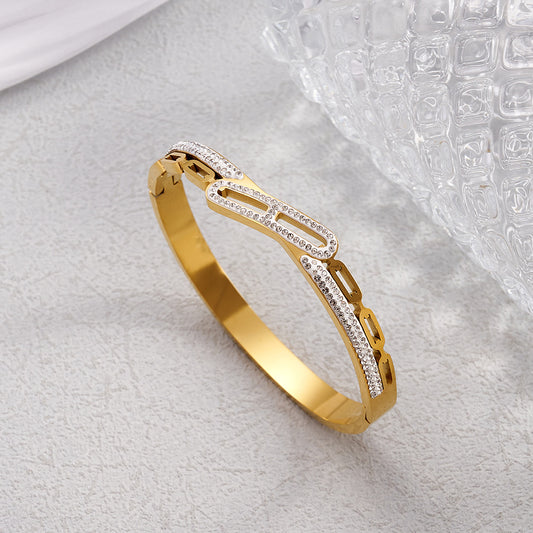 Βραχιόλι χειροπέδα με κεντρική  μπάρα από στρας χρυσό